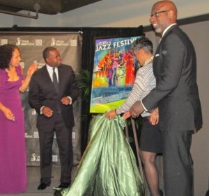 Atlanta Mayor Kasim Reed and Alexandra Jackson (both left) respond to the unveiling of the poster for the 2013 Atlanta Jazz Festival. Credit: rollingout.com