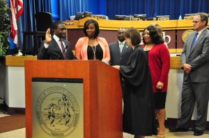 DeKalb County Commissioner Lee May (left) takes oath of office July 17 as interim CEO. Credit: DeKalb County