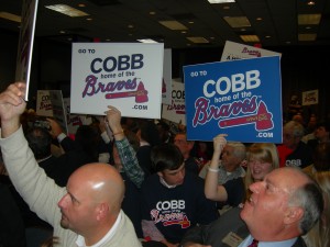 pro-Cobb stadium advocates proudly wave their slick posters (Photos by Maria Saporta)