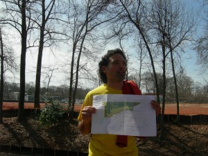 Angel Poventud points to the map snowing how the trees behind his renovated house will be cut down because of the urban farm.