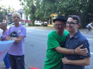 Rick Westbrook hugs a supporter as Art Izzard, the outreach director, looks on