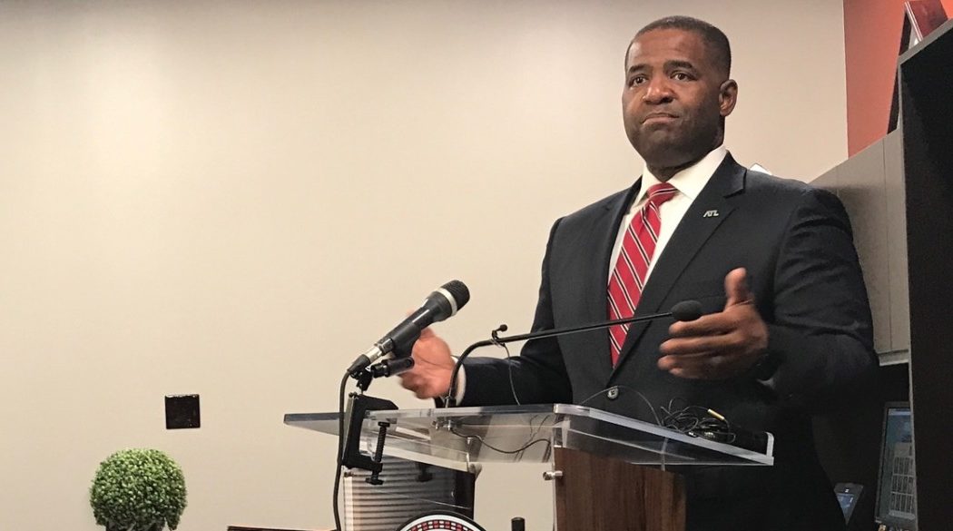 Atlanta City Council President Ceasar Mitchell, pictured in his City Hall office on Thursday, is defending his proposal for a moratorium on contracts that begin service in 2018, against heated criticism from Mayor Kasim Reed. Reed has called the idea a "donor protection bill" in Mitchell's bid for mayor.