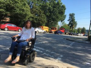 Karen DeVault crosses a poorly-marked crosswalk in Buckhead. She said the city needs to get its act together on sidewalks. Credit: Maggie Lee