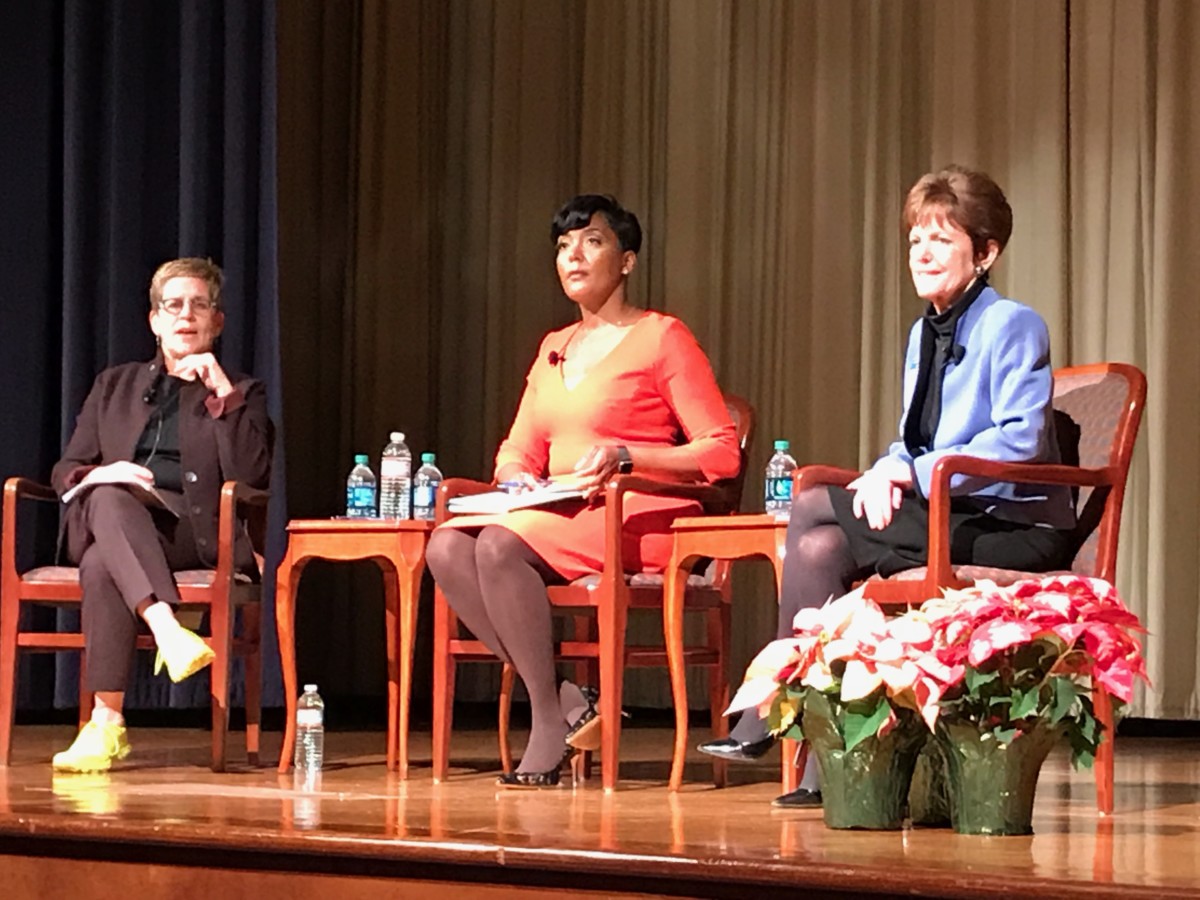 Cathy Woolard, in her trademark yellow tennis shoes on Tuesday night, quizzed the two women who made it into the third round of the mayoral race: Keisha Lance Bottoms and Mary Norwood. Credit: Maria Saporta