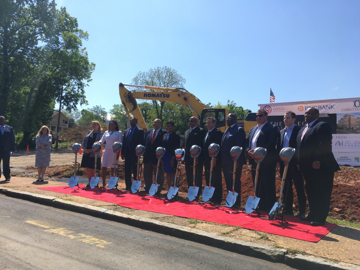 Officials and organizers pose at the ceremonial groundbreaking for The Legacy at Vine City on Friday. It will be an apartment building for seniors, priced below market rate. Credit: Maggie Lee