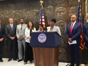 Atlanta Mayor Keisha Lance Bottoms, surrounded by council and staff members, announces that city spending down to the checkbook level is now online for the last two years. It'll be updated quarterly. Credit: Maggie Lee