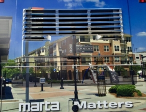 The buildings around and atop MARTA's Lindbergh Center station are a mixed-use "transit-oriented development:" apartments, shops and restaurants all easy to get to by foot from bus and train stops. Credit: Kelly Jordan