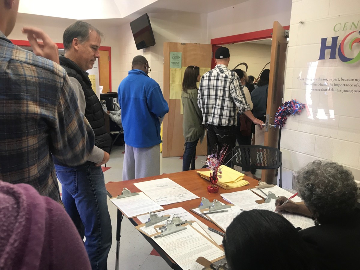 Poll workers and folks waiting to vote at DeKalb's Bessie Branham Recreation Center, Nov. 6, 2018. Credit: Britton Edwards