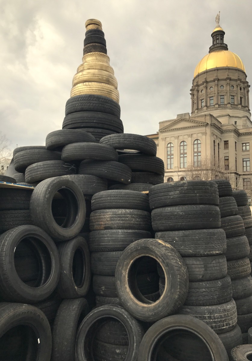 A file photo from March 2017 shows tires heaped outside the Georgia state Capitol in protest of diversion of tire cleanup money. Credit: Kelly Jordan
