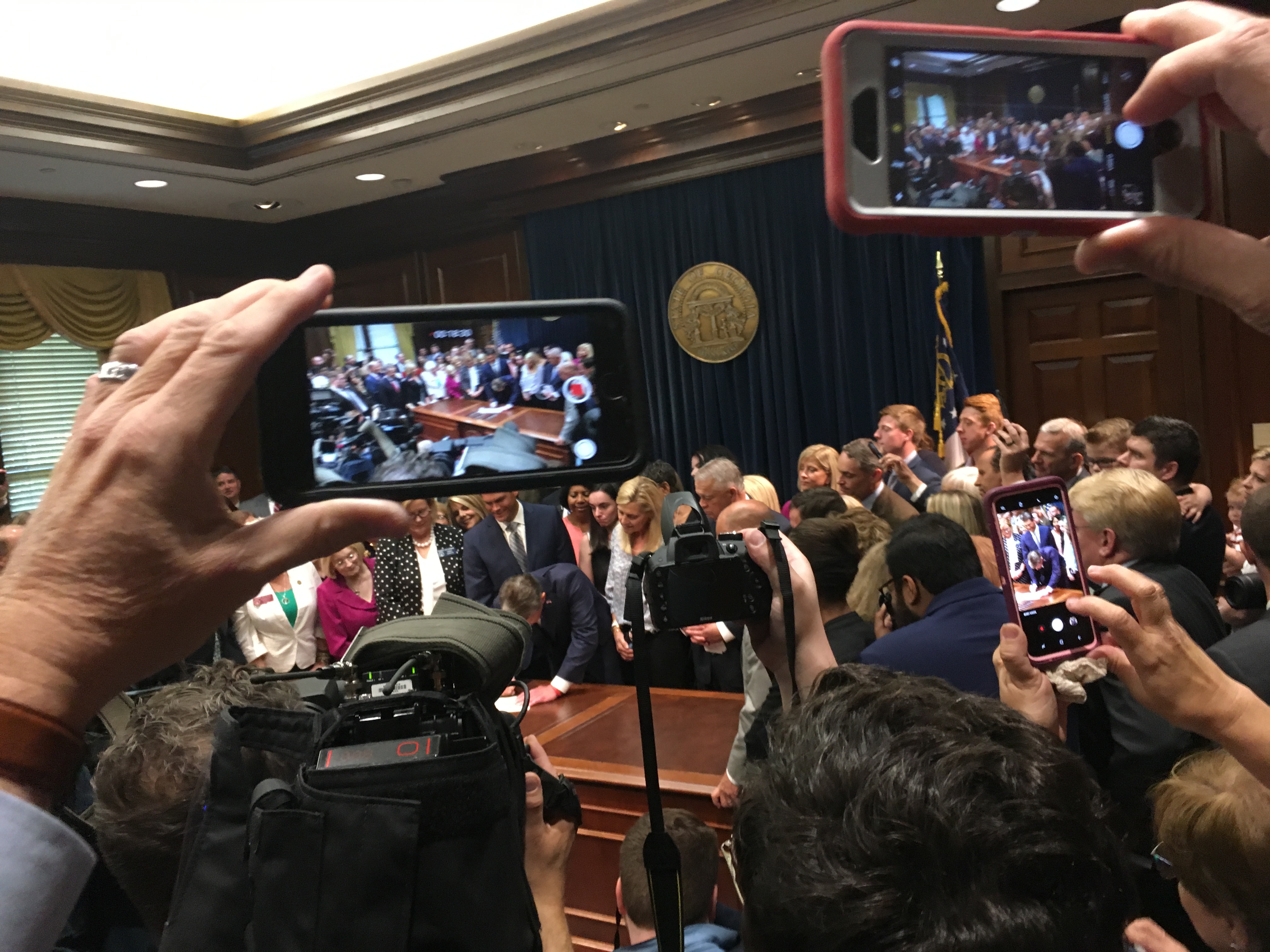 In front of supporters and media, Georgia Gov. Brian Kemp signed a bill he promised to support during his campaign: a near-total ban on abortion after six weeks of pregnancy. Credit: Maggie Lee