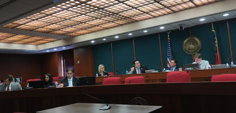 Members of the Georgia Government Transparency and Campaign Finance Commission sitting in a meeting room