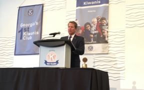 Brian Kemp at a podium at Kiwanis meeting