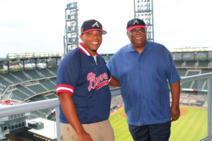 Award winner Reginald Hollins (l) and his dad on Tuesday night, during the VIP Experience at the Omni Hotel at the Battery Atlanta overlooking the Braves Game at Truist Park (Special: Truist Park)