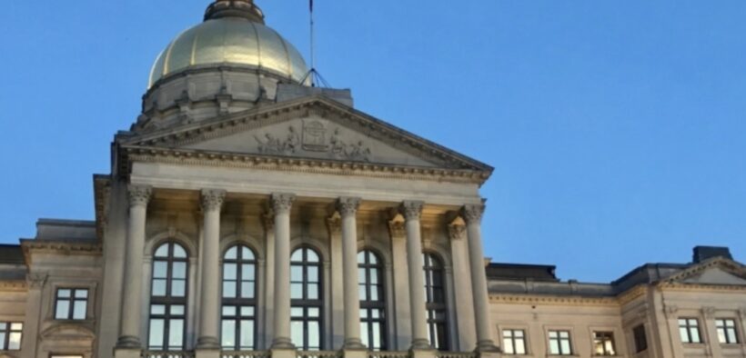 Thge exterior of the Georgia state capitol building and its gold dome